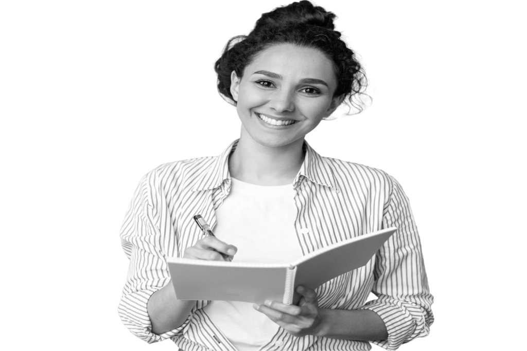 Founder of Mise smiling and holding a notebook